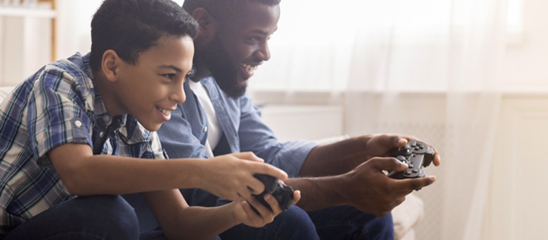Father and son playing video games